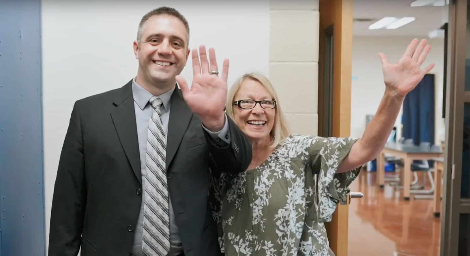 faculty waving