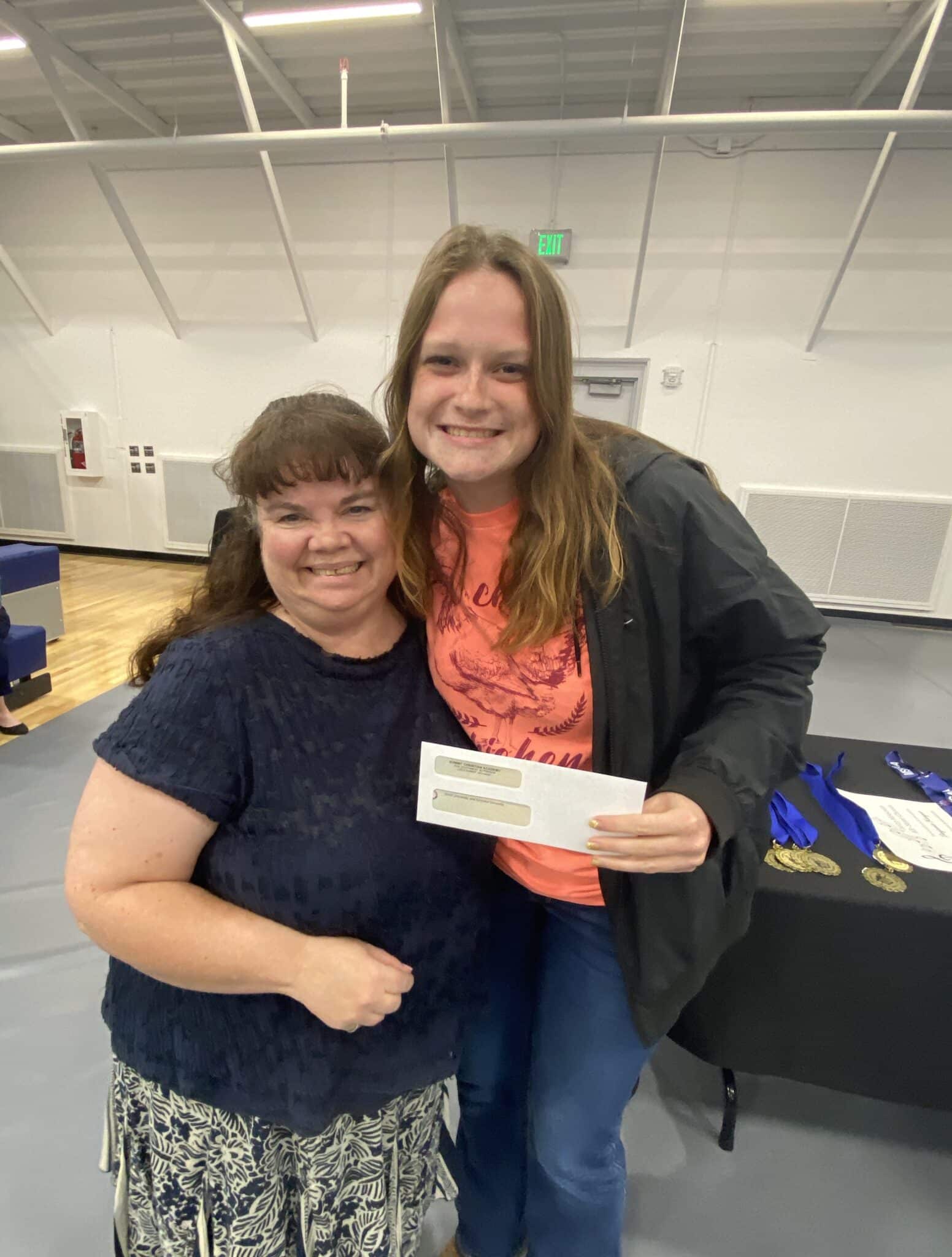 SCA senior Emirson Schooley, pictured with SCA Business Teacher Georgia Duncan, was the recipient of the Summit Christian Academy Entrepreneurship Scholarship for her plan for her farming business “Sunshine Fields.”