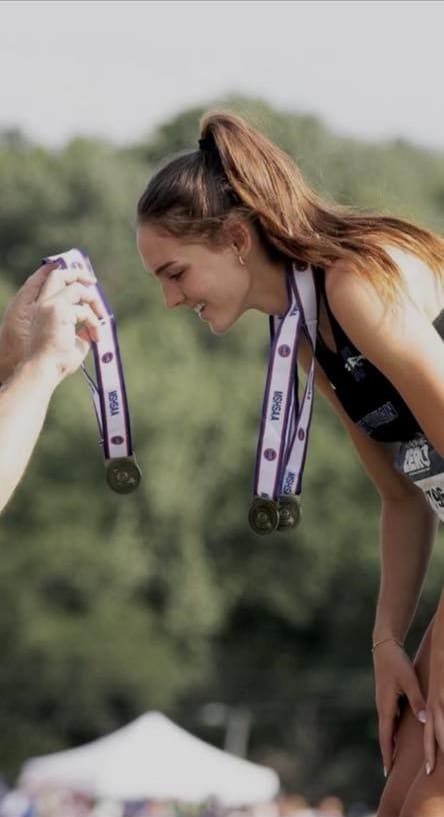 PHOTO CAPTION: Summit Christian Academy senior April Phillips receives her 3rd gold medal at the MSHSAA Class 3 State Track & Field tournament.