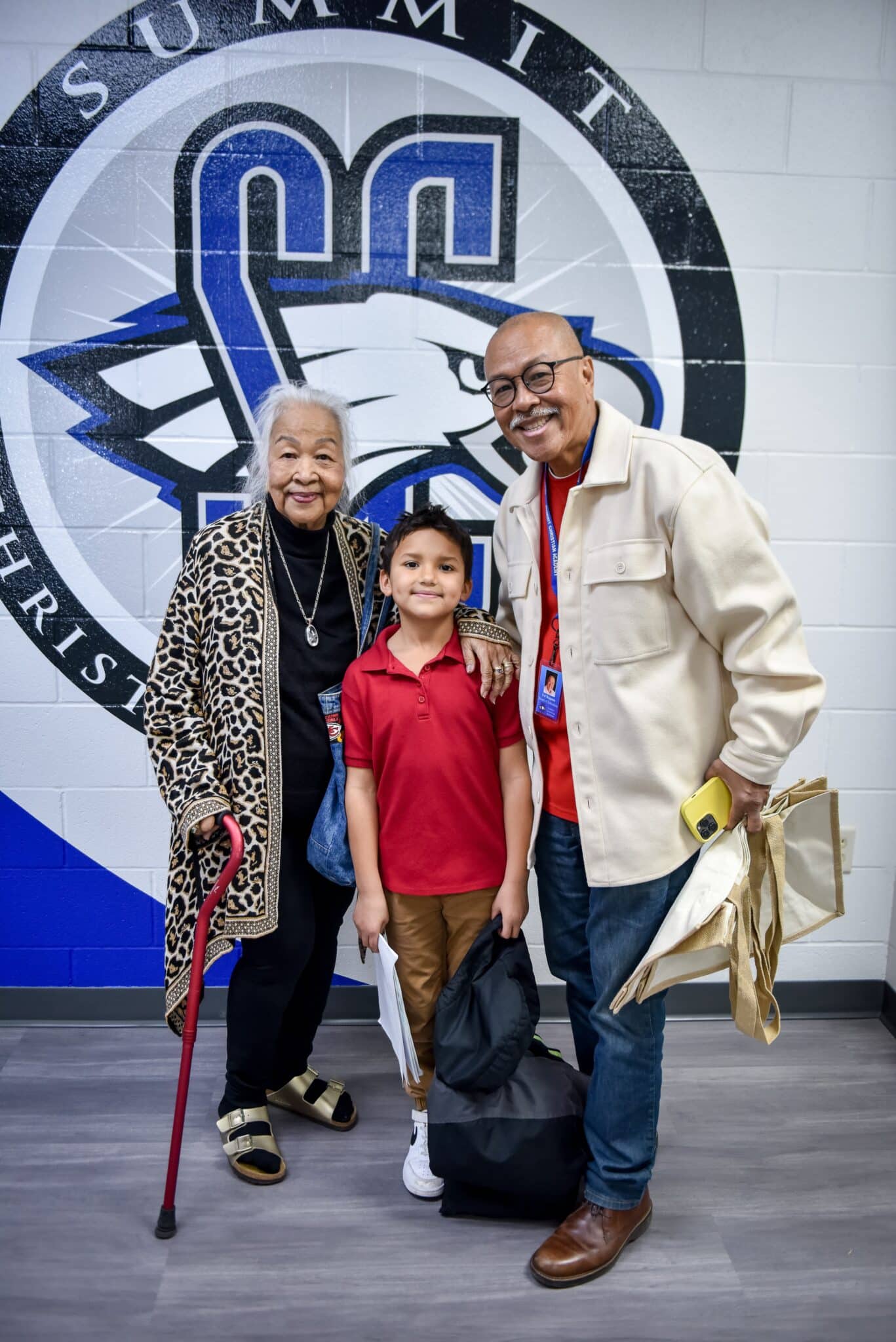SCA first grade student Isaiah Bagunu enjoys getting picked up from the half-day of school by his father and grandmother on Grandparents’ Day.