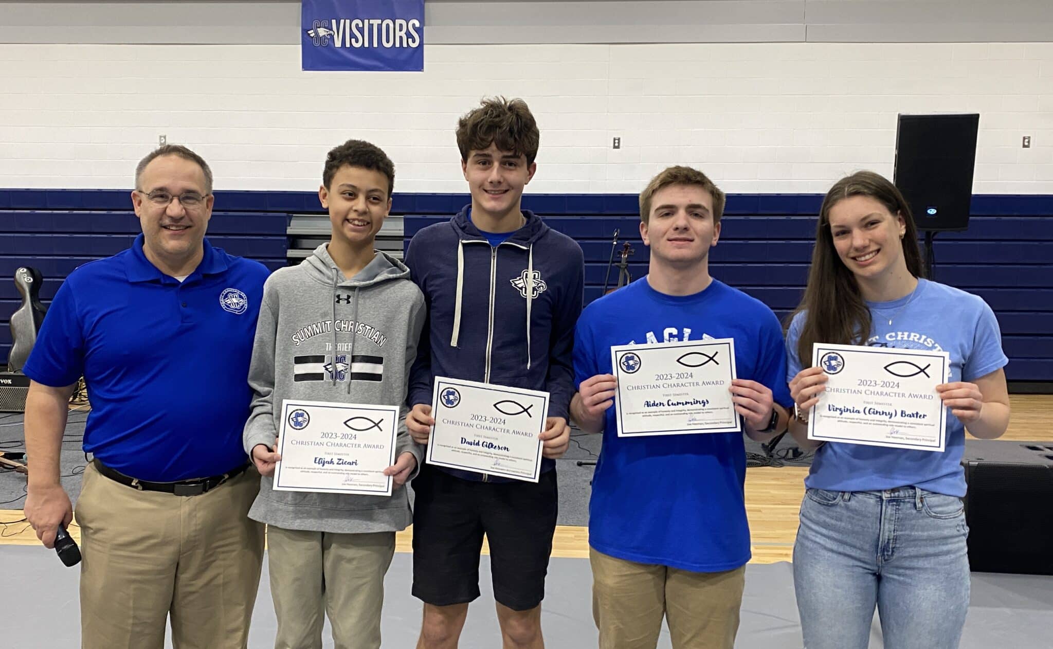 SCA recently announced the Secondary Christian Character Recipients for the 2023-24 first semester. Pictured left to right are SCA Secondary Principal Joe Hesman with award winners eighth grade student Elijah Zicari, senior David Gilkeson, sophomore Aidan Cummings, and senior Ginny Baxter. Not photographed is eighth grade student Regan McCarty.