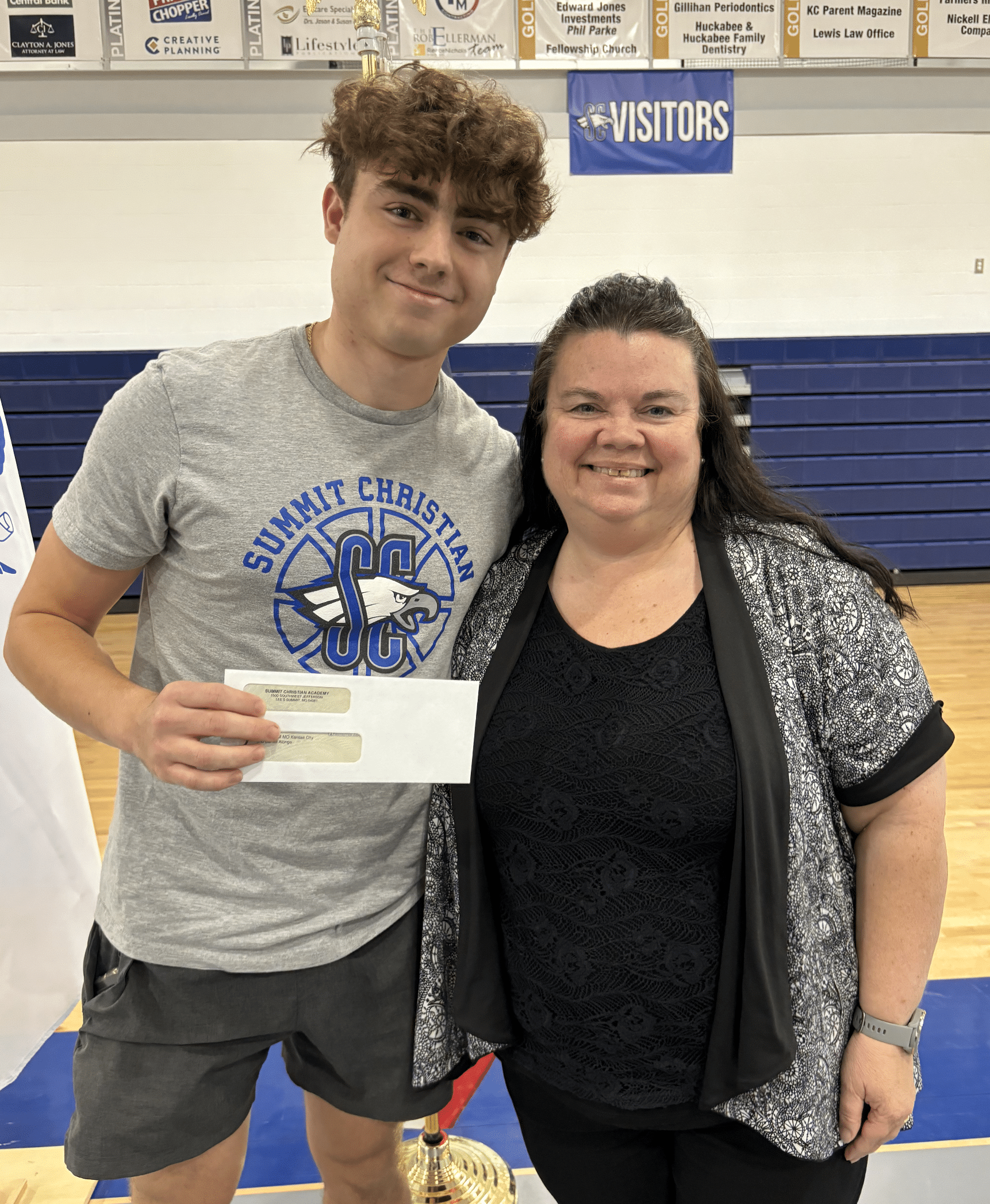 SCA senior Daniel Alonge, pictured with SCA Business Teacher Georgia Duncan, was the recipient of the Summit Christian Academy Entrepreneurship Scholarship for his plan “Fresh n’ Fit” a cafe and supplement store.