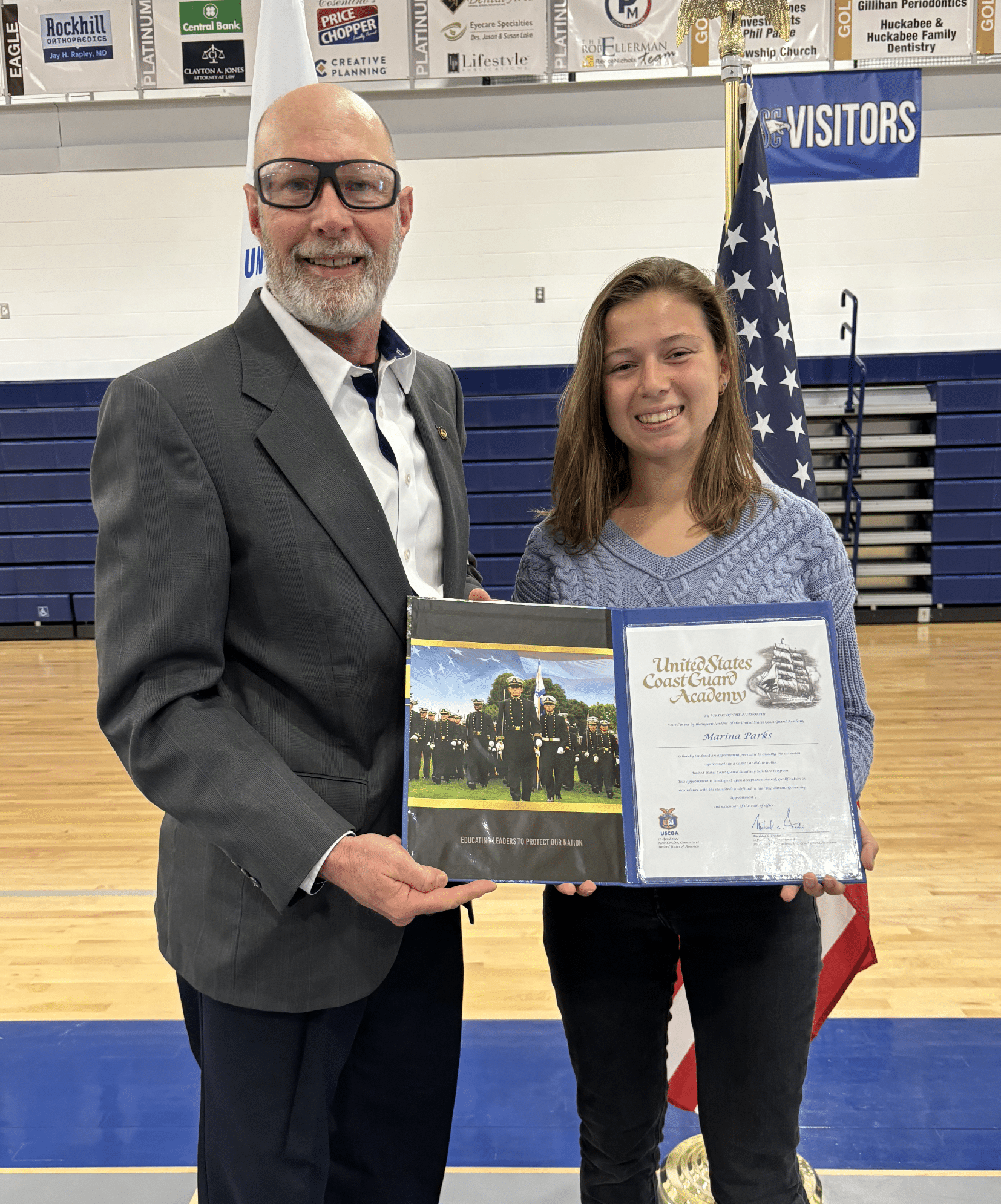 SCA 2024 graduate Marina Parks, pictured with Captain Steve Ohms of the United States Coast Guard, was offered a $30,000 scholarship and appointment to the United States Coast Guard Academy Scholars Program.