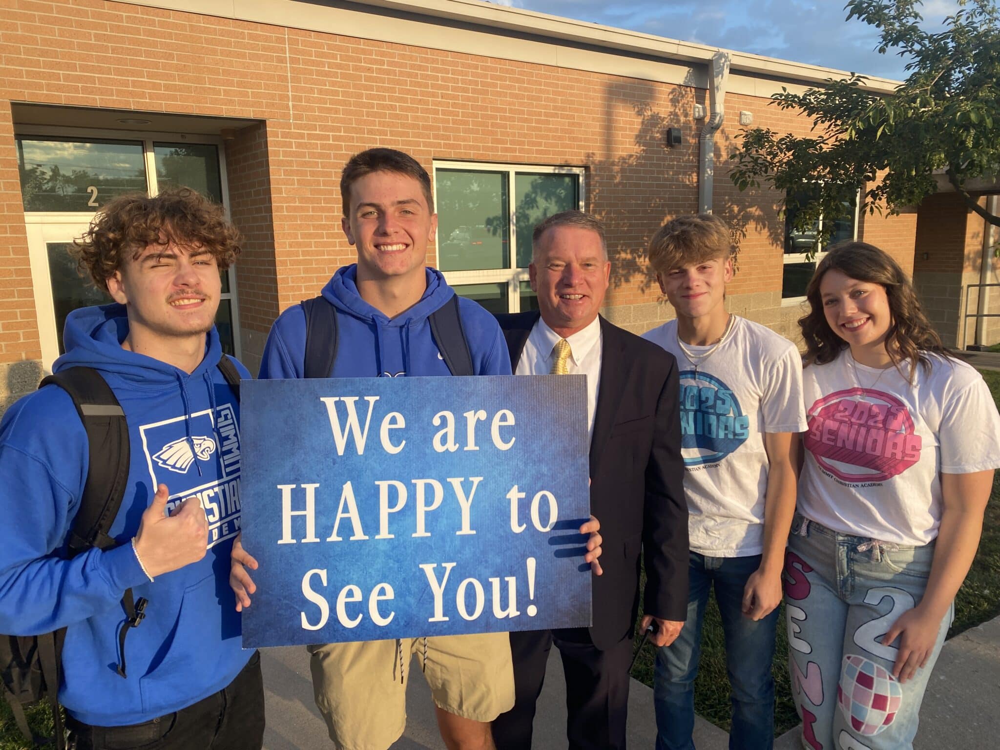 The SCA Class of 2025 gathered before classes started on the first day of school for Worship and Waffles before welcoming all students to campus. Pictured with SCA Head of School Chris Hahn, SCA Seniors including (l-r) Drew Hawkins, Brayden Porter, Levi Tomlin, and Avery Whitfield greeted SCA students of all grades with worship music, posters, words of encouragement, and cheers as they entered their first day of school.