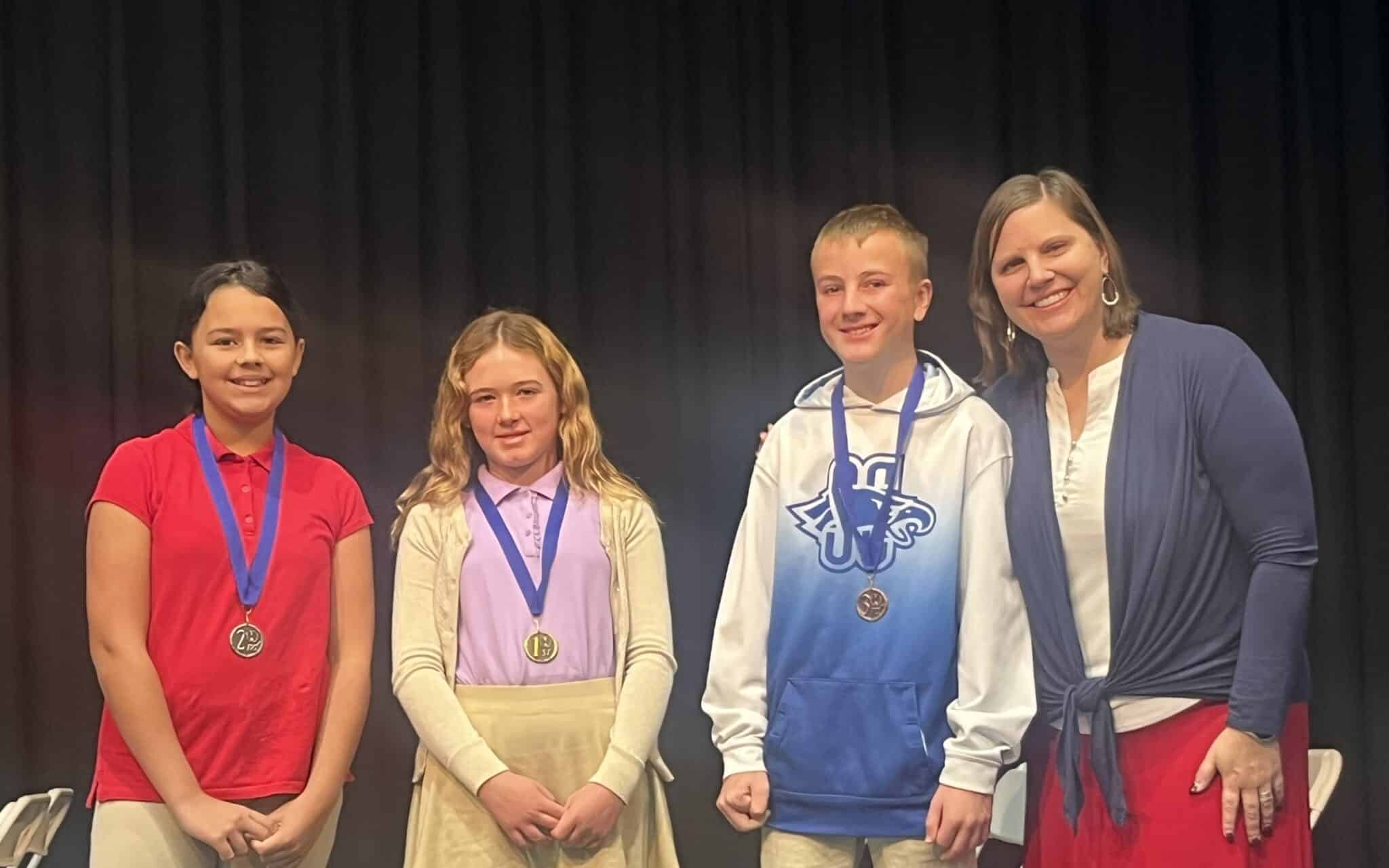 SCA is proud of the hard work and achievement of 52 students who participated in the annual SCA spelling bees. Pictured here (l-r) are second place winner Eden Cervantes, first place winner Sterling Brockhouse, third place winner Collin Boor, and SCA Elementary Principal Kelly Montgomery.