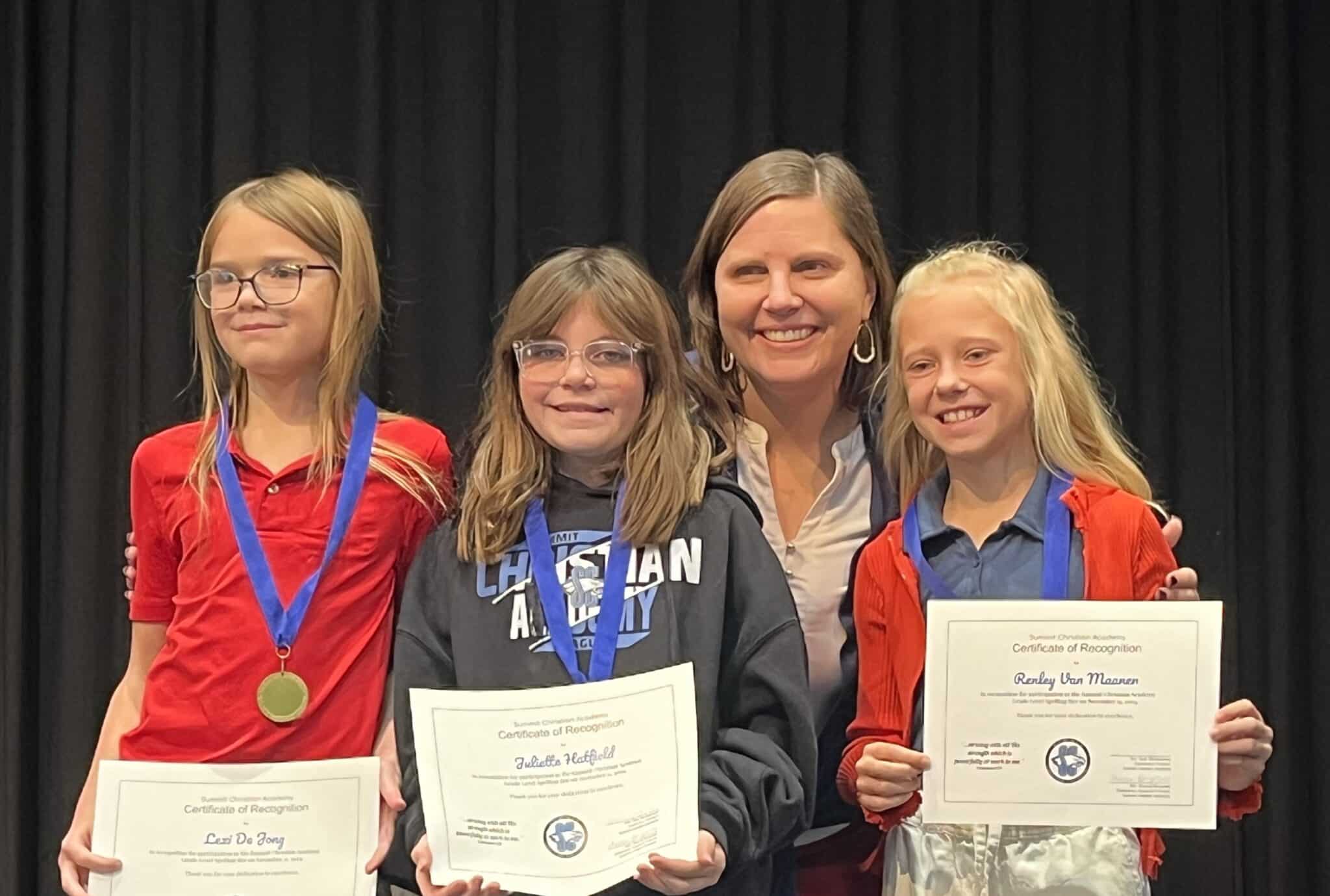 Pictured here (l-r) are SCA fourth grade spelling bee winners: third place winner Iris Mills, first place winner Elliana Worth, second place winner Luke Eagleburger, with SCA Elementary Principal Kelly Montgomery.