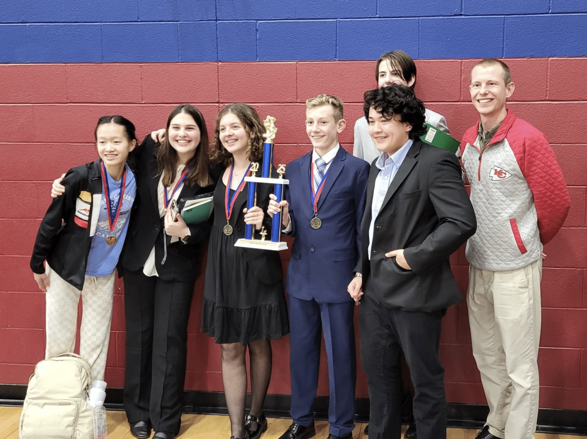 SCA’s Junior High Speech & Debate Team took first place in the small school division during their first tournament. Front row, left to right: Maggie Daly, Isabella Gamboa, Sadie Lovins, Spencer Lesley, & Sam Fulton. Back row, left to right: Finn Carrell and SCA Jr. High Speech & Debate Teacher Patrick Love