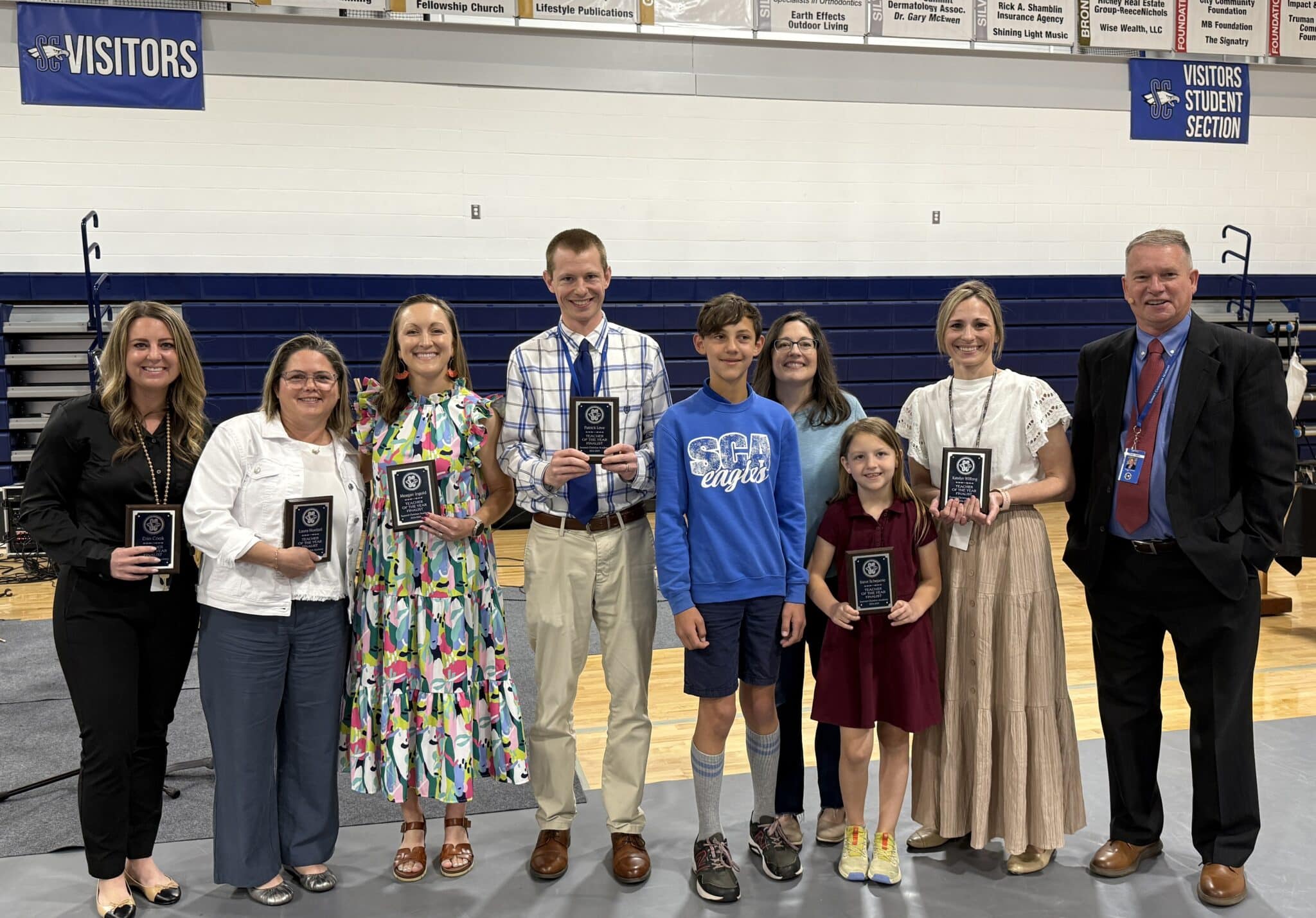 SCA’s 2025 Teacher of the Year finalists (left to right): Mrs. Erin Cook, Mrs. Laura Hoelzel, Mrs. Meagan Ingold, Mr. Patrick Love, representing Dr. Steve Scheperle was his wife Mindy and children Sam and Sydney, Mrs. Katelyn Wilfong, pictured with SCA Head of School Chris Hahn (far right).